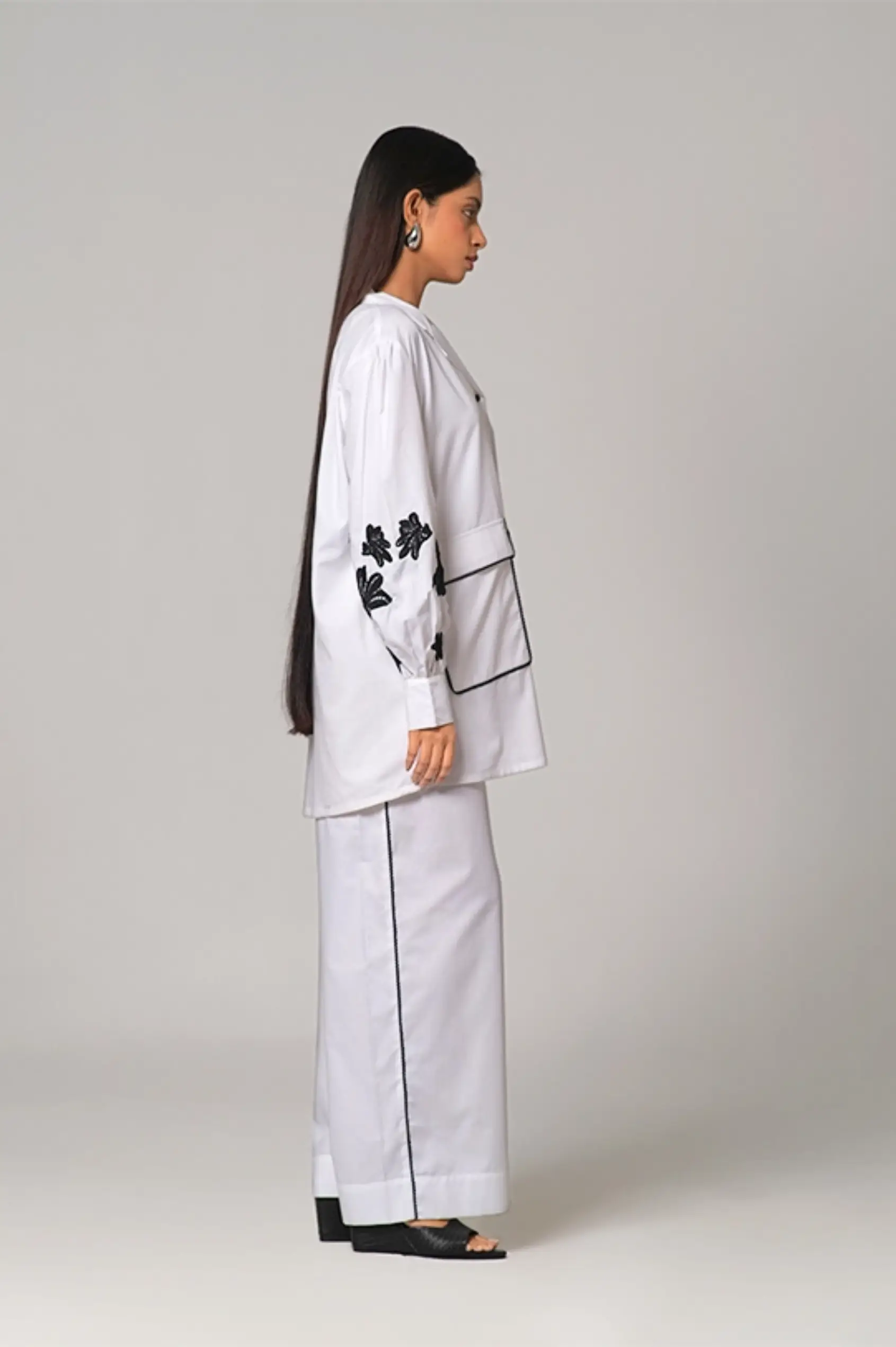 Camp collar Shirt paired with wide legged pants.