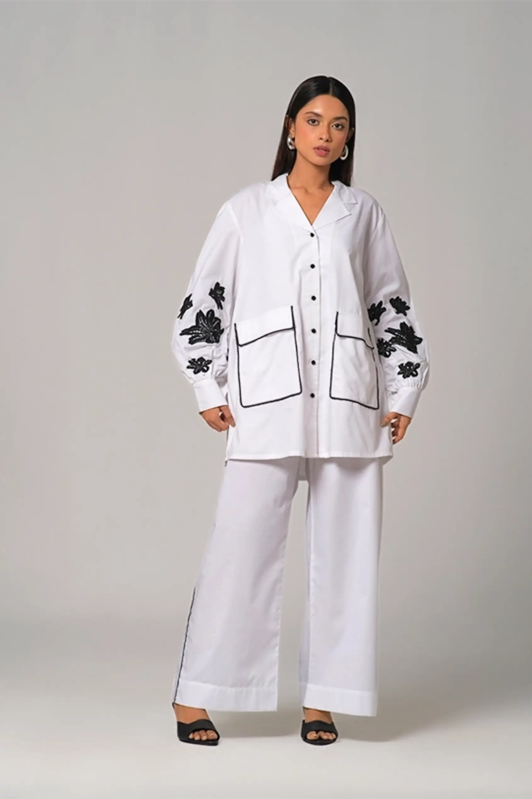 Camp collar Shirt paired with wide legged pants.