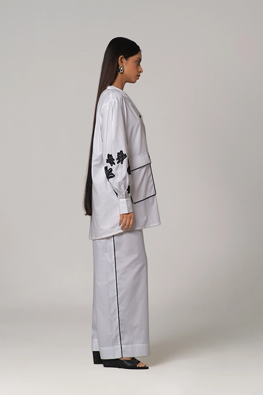 Camp collar Shirt paired with wide legged pants.